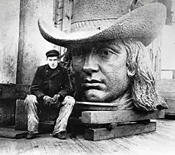 Tacony Iron Works employee, 18-year-old Frederik Ullberg with the head of Alexander Milne Calder's statue of William Penn.
