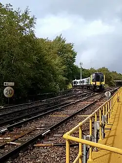 A train from Ascot joins the line from Woking at Ash Vale Junction in August 2023.