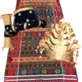The traditional clothing of the Batak Angkola consists of ulos godang, ampu, and bulang.