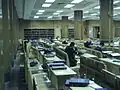Men learning in the beis medrash in the lower level of the building.