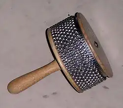 Ball chain surrounding the cabasa produces its sound when it is shaken