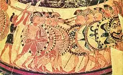 A Greek vase, showing two groups of armoured soldiers about to clash: one side has a flute-player.
