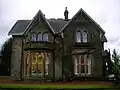 The side of the house which faces Geilsland Road and Speir's school grounds