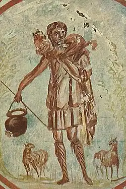 Circa 250-300 A.D. The Good Shepherd, Callixitus Catacomb, Crypt of Lucina. The pail (of milk?) carried by the Shepherd has been seen as symbolizing the Eucharist.[20]
