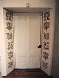 Handpainted doorway inside the adobe.