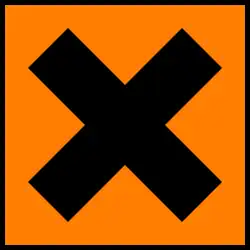 A square orange sticker with a black cross on it.