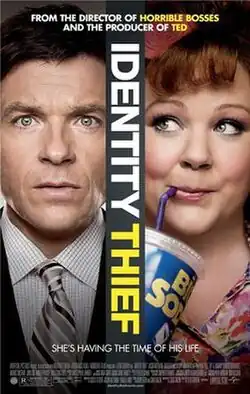 A serious looking man in a gray suit. A happy looking woman sipping a large drink through a straw.
