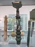 Bronze four-nozzled lamp-stand