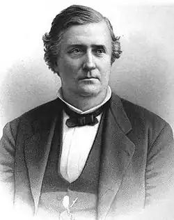 Black and white drawing of a white man wearing a white shirt, dark bow tie, and dark jacket and vest