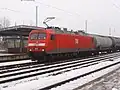 Red locomotive with grey roof and lower body side stripe an MEG logos