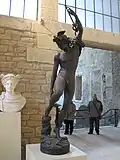 Mercury attaching his wings