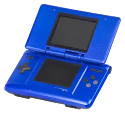 Close up photograph of a handheld electronic video game system. The blue device consists of two flat rectangular pieces connected by a hinge. Both pieces have a small rectangular screen and the bottom piece has a directional pad and input buttons.