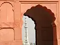 The richly framed by an aisle arch
