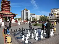 Playing chess near the Seven Days Pagoda, Elista