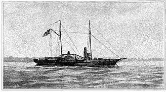 "Black and white image of USS Hetzel from a watercolor painting. She lies at anchor, her clipper bow to the right. She carries two masts; a large American flag flies from the gaff of the after (main) mast. The starboard sidewheel is a little aft of directly midship. The single stack is about equally far forward. Superstructure includes a pilot house forward of the stack, some parts of the engines, and a row of cabins aft of the stack. One gun is mounted on the main deck forward, and another is at the stern."