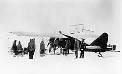 Wop May loads his airplane at Aklavik